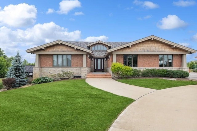 craftsman-style house with a front lawn