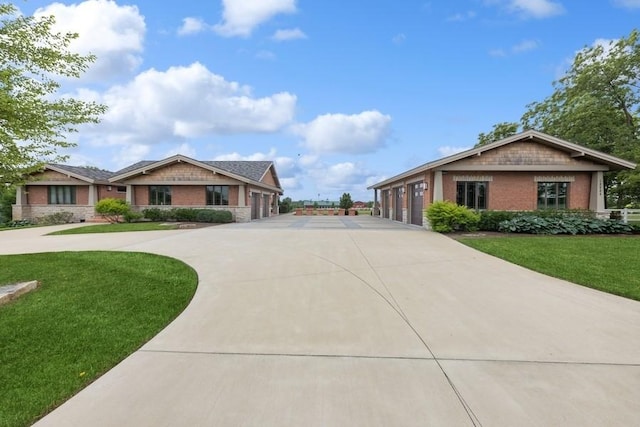 view of front of property with a front lawn and a garage