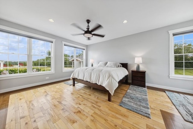 bedroom featuring ceiling fan and light wood-type flooring