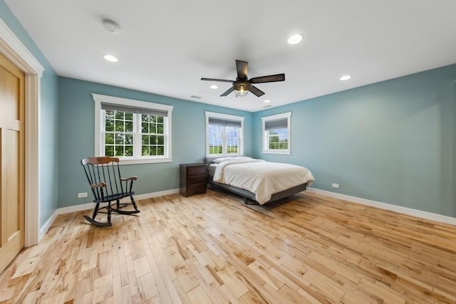 bedroom with light wood-type flooring and ceiling fan