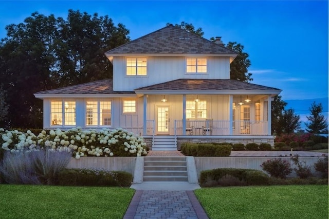 view of front of home with a yard and a porch