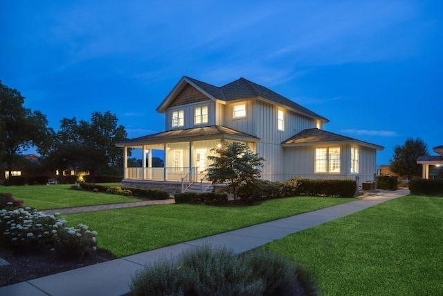 view of front of home featuring a porch and a yard