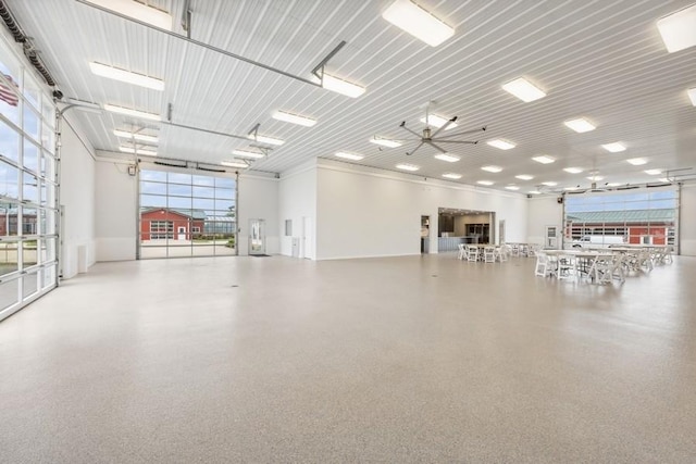 interior space with ceiling fan