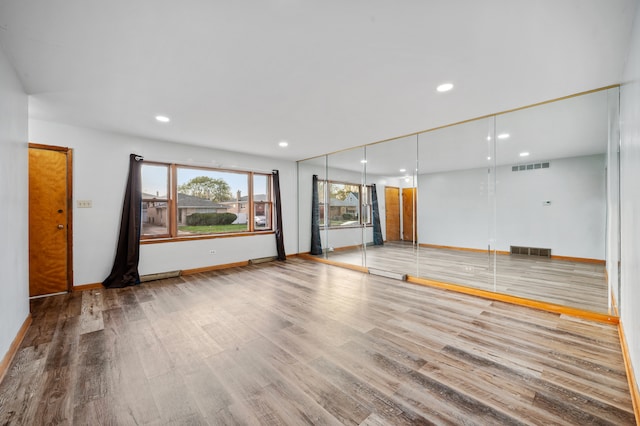 spare room featuring hardwood / wood-style flooring