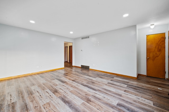 unfurnished room with light wood-type flooring