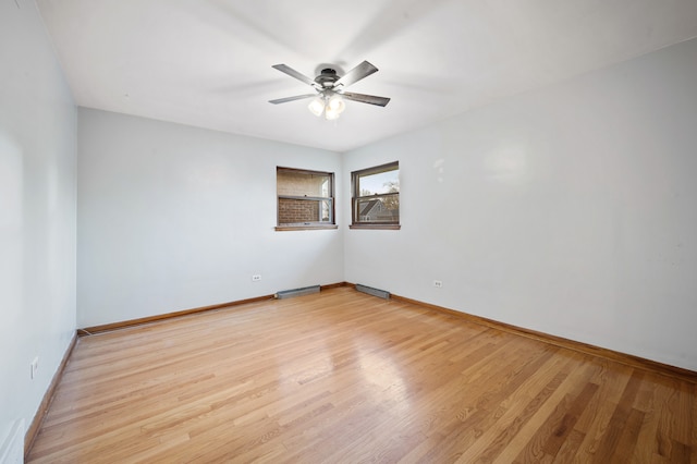 unfurnished room featuring light wood-type flooring and ceiling fan