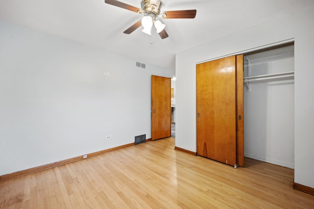 unfurnished bedroom featuring a closet, ceiling fan, and light wood-type flooring