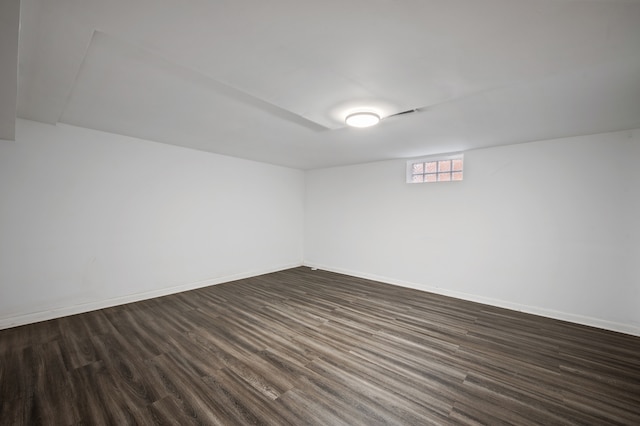 basement featuring dark wood-type flooring