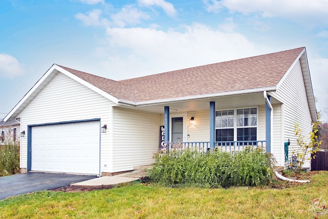 ranch-style house with covered porch and a garage