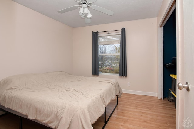 bedroom featuring ceiling fan and light hardwood / wood-style flooring