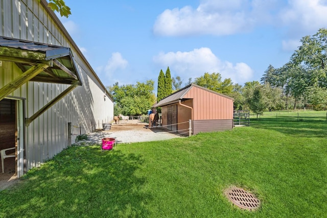 view of yard with an exterior structure and an outbuilding