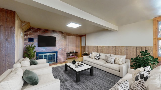 living room featuring a wainscoted wall, a brick fireplace, beamed ceiling, and wood walls