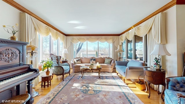 sitting room featuring crown molding and wood finished floors