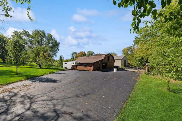 view of front of property with a front yard and driveway