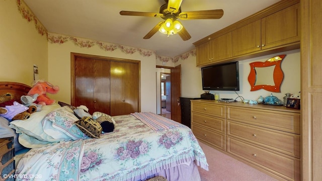 bedroom featuring carpet floors, a ceiling fan, and a closet