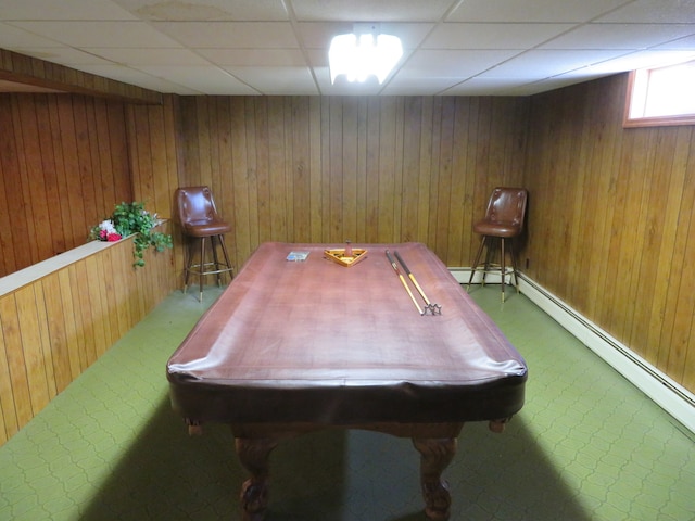 game room featuring a paneled ceiling, billiards, a baseboard heating unit, and wood walls