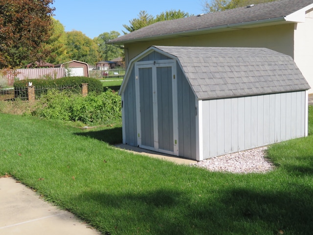 view of outdoor structure with a lawn