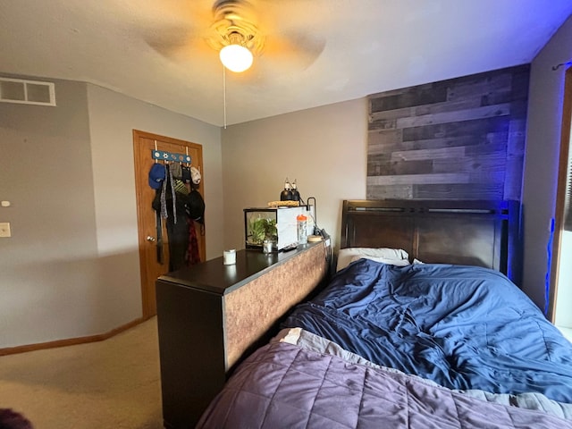 carpeted bedroom with ceiling fan