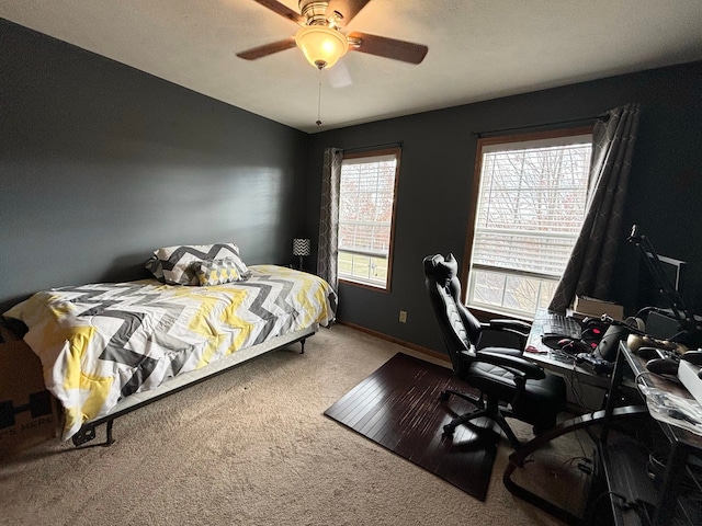 bedroom featuring ceiling fan and carpet flooring