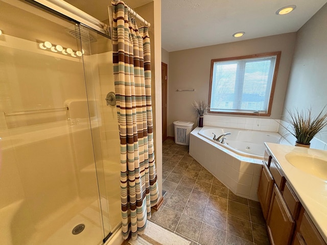 bathroom featuring vanity, tile patterned floors, and separate shower and tub