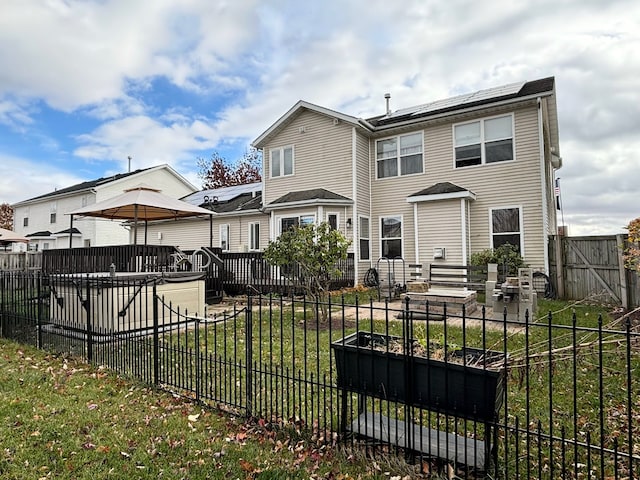 rear view of property with a patio and a yard