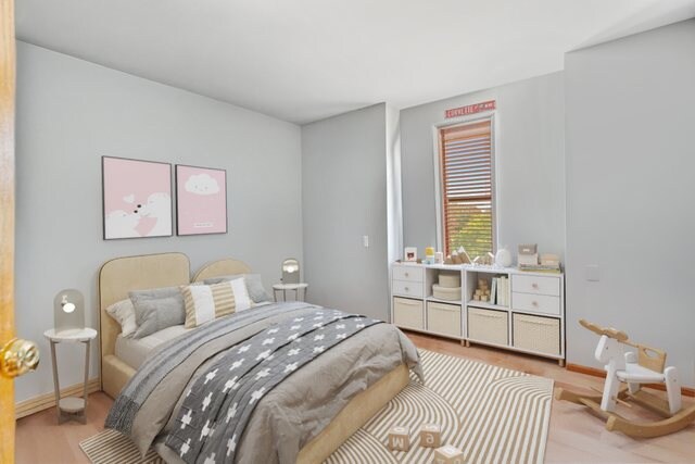 bedroom featuring light hardwood / wood-style floors