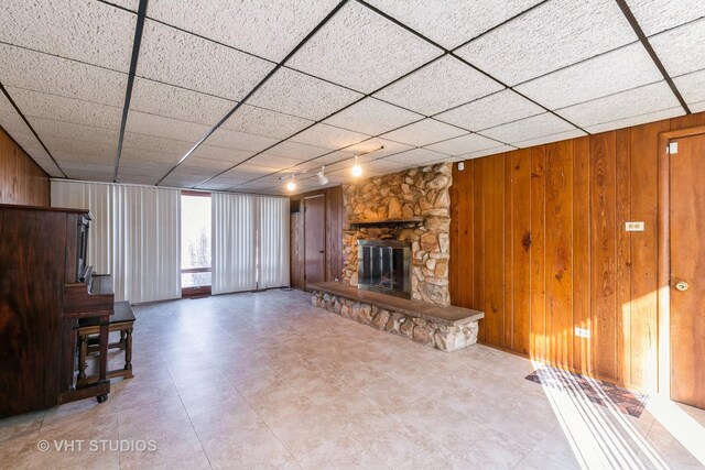 basement featuring white refrigerator and water heater