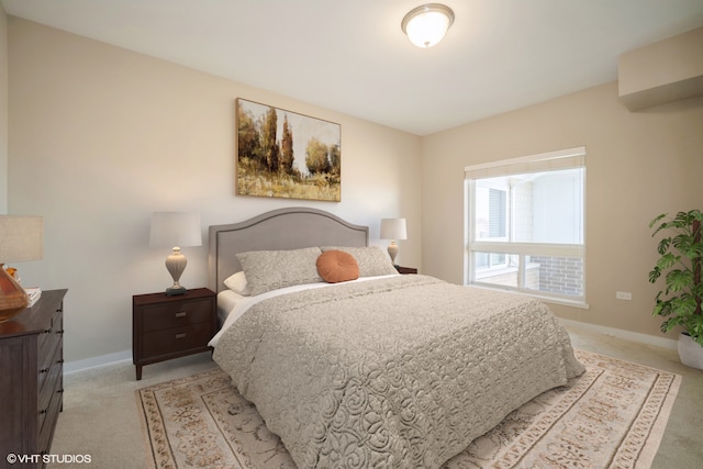 bedroom featuring light colored carpet