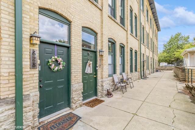 doorway to property featuring a patio