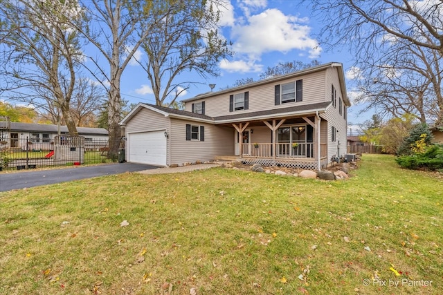 front facade featuring a front lawn, a porch, and a garage