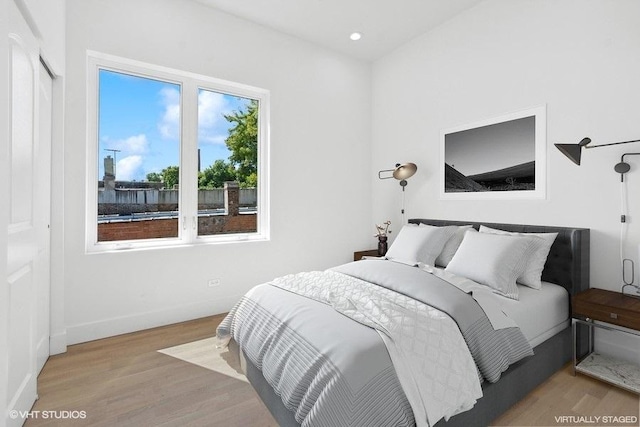 bedroom with light hardwood / wood-style floors