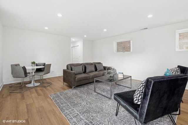 living room with light hardwood / wood-style flooring