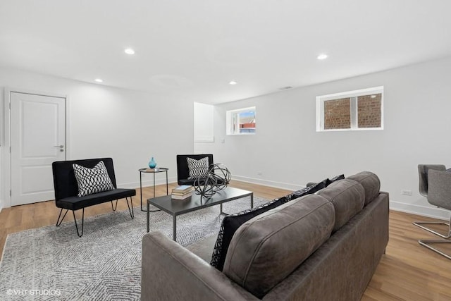 living room with light hardwood / wood-style flooring