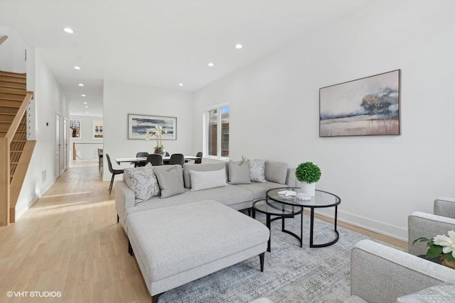 living room with light hardwood / wood-style flooring