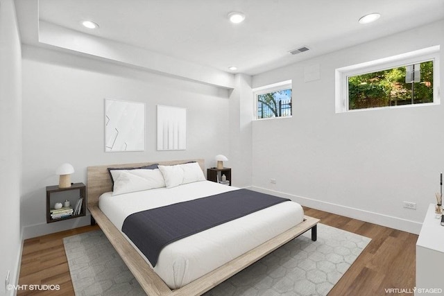 bedroom featuring dark wood-type flooring