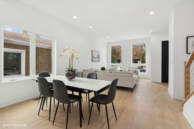 dining space with light hardwood / wood-style flooring