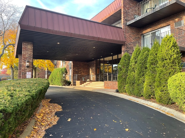 exterior space featuring a carport