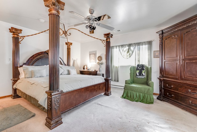 carpeted bedroom featuring a baseboard radiator and ceiling fan