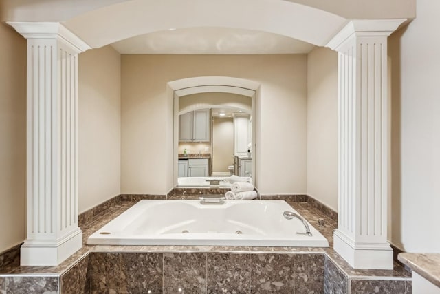 27 N Tower Rd Unit 27, Oak Brook, IL 60523 - bathroom with ornate columns, a tub with jets, and vanity