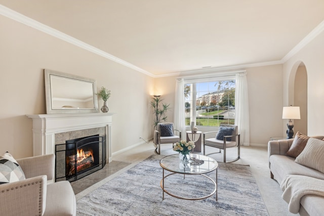 living room with a tiled fireplace, light carpet, and ornamental molding