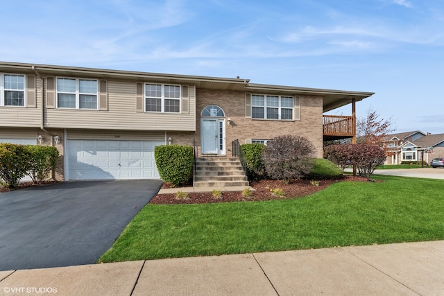 view of front of house featuring a front yard and a garage