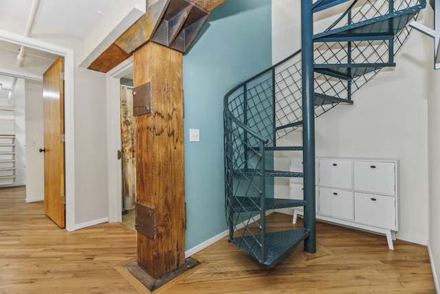 staircase featuring hardwood / wood-style floors