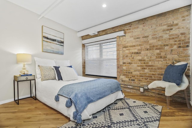 bedroom with hardwood / wood-style floors