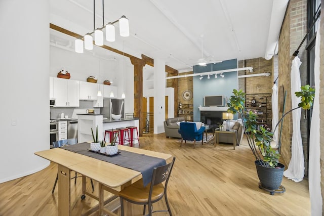 dining room featuring ceiling fan and light hardwood / wood-style floors