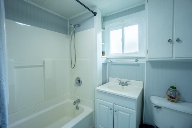 full bathroom with shower / bathing tub combination, crown molding, vanity, and toilet