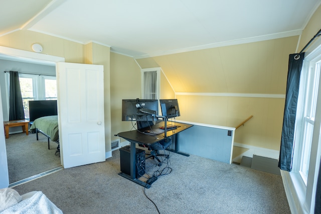 carpeted home office featuring vaulted ceiling