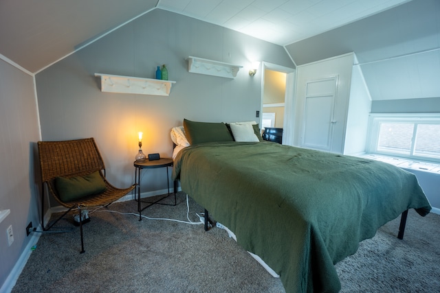 carpeted bedroom featuring vaulted ceiling