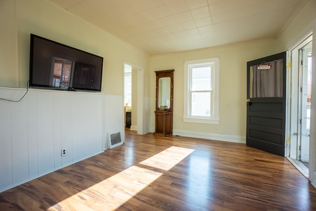 interior space featuring crown molding and hardwood / wood-style flooring