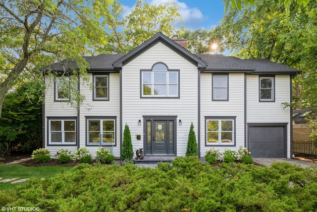 view of front of property with a garage