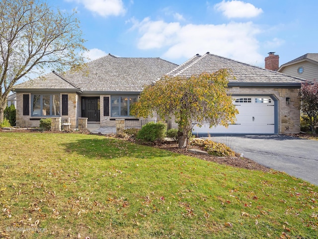 single story home with a front lawn and a garage